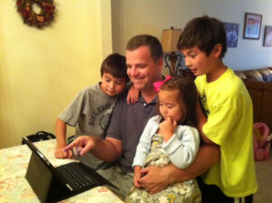 Conklin at home, sharing a new IMK story with his children