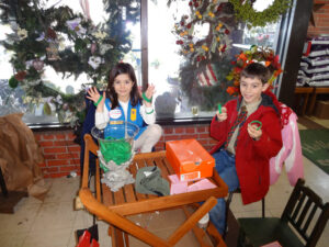 Newtowners Ryan and Anna selling "We Are Newtown" bracelets at Hollandia Nursery